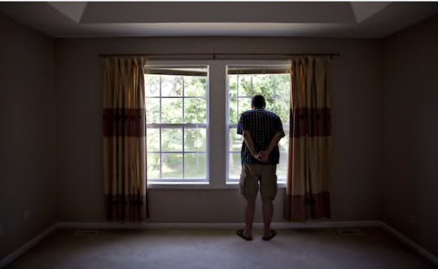 A prospective home buyer looks out the master bedroom window at a house for sale in Dunlap, Ill, on Aug. 19, 2018. MUST CREDIT: Bloomberg photo by Daniel Acker.