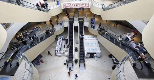 Shoppers walk through the Queens Center shopping mall in the Queens borough of New York on Sept. 9, 2020. MUST CREDIT: Bloomberg photo by Peter Foley.