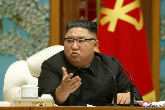 North Korean leader Kim Jong-un speaks during a politburo meeting of the Workers' Party in this photo disclosed by the Korean Central News Agency on Monday. (KCNA-Yonhap)