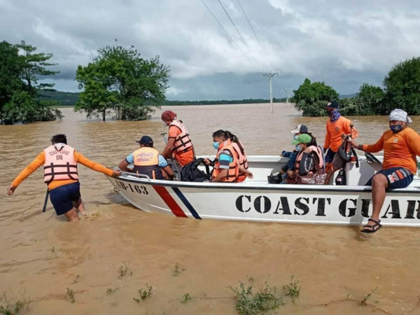 EMERGENCY Coast guards transport a dialysis patient from her home in Alcala townto Tuguegarao City, Cagayan province, for her scheduled checkup.—PHOTO COURTESY OF THE PHILIPPINE COAST GUARD