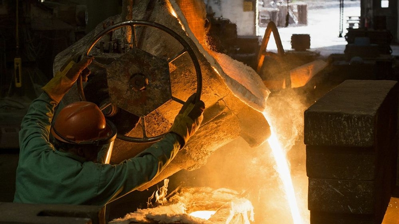 A worker pours molten metal from a furnace at a castings facility in Salem, Ohio, on Aug. 24, 2016. MUST CREDIT: Bloomberg photo by Ty Wright.