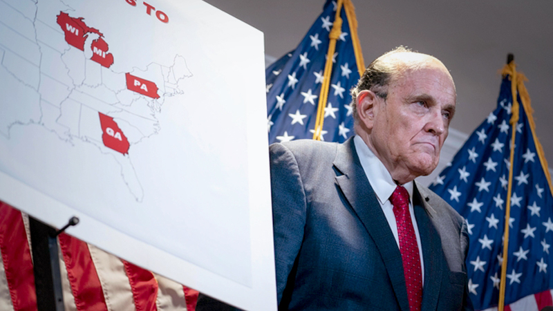 President Trump's attorney, Rudy Giuliani, is pictured alongside a map showing four key states in red during a news conference Thursday at the Republican National Committee headquarters in Washington, D.C. Photo by Sarah Silbiger for The Washington Post