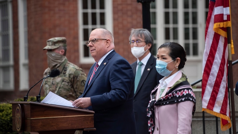 Gov. Larry Hogan, with his wife, Yumi Hogan, right, announces the initial purchase of 500,000 coronavirus tests from South Korea. MUST CREDIT: Washington Post photo by Michael Robinson Chavez.