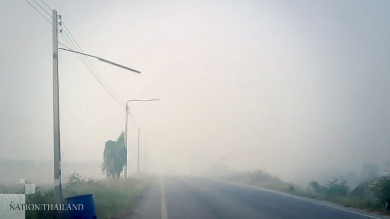 White-knuckle drivers brave smoggy northern road White-knuckle drivers brave smoggy northern road