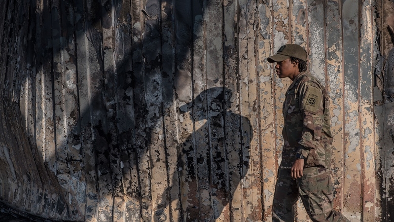 A U.S. soldier walks past a wall burned in the Iranian airstrike at the Ain Al-Asad base near Anbar, Iraq, on January 13, 2019. MUST CREDIT: Photo for The Washington Post by Emilienne Malfatto