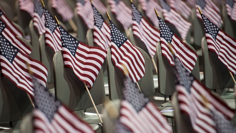 American flags await the more than 220 people from more than 40 countries participating in the Fiesta of Independence Naturalization Ceremony at South Mountain Community College in Phoenix on July 4, 2018. MUST CREDIT: Washington Post photo by Carolyn Van Houten.