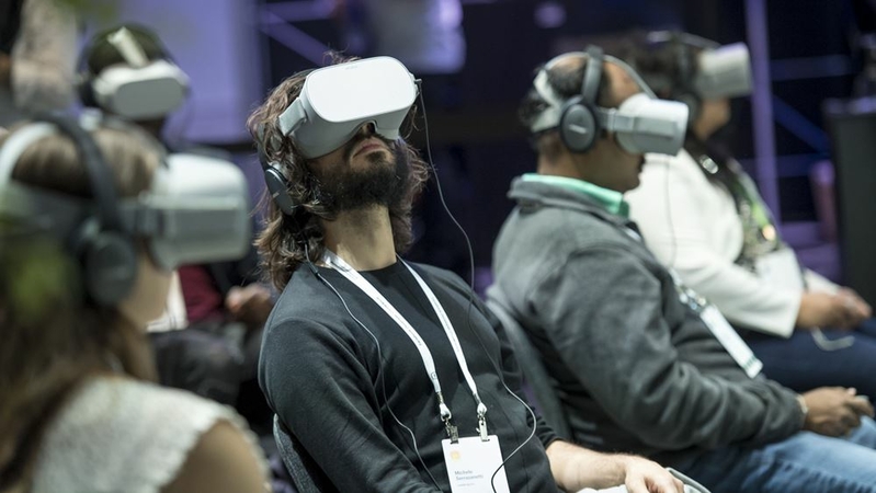 Attendees use Oculus VR Inc. headsets during the F8 Developers Conference in San Jose, Calif., on April 30, 2019. MUST CREDIT: Bloomberg photo by David Paul Morris.