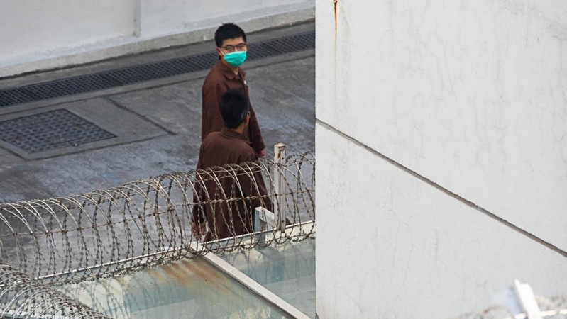 Joshua Wong, activist and former member of pro-democracy party Demosisto, wearing a protective mask while walking through the Lai Chi Kok Reception Center in Hong Kong on Dec. 3, 2020. MUST CREDIT: Bloomberg photo by Billy H.C. Kwok.