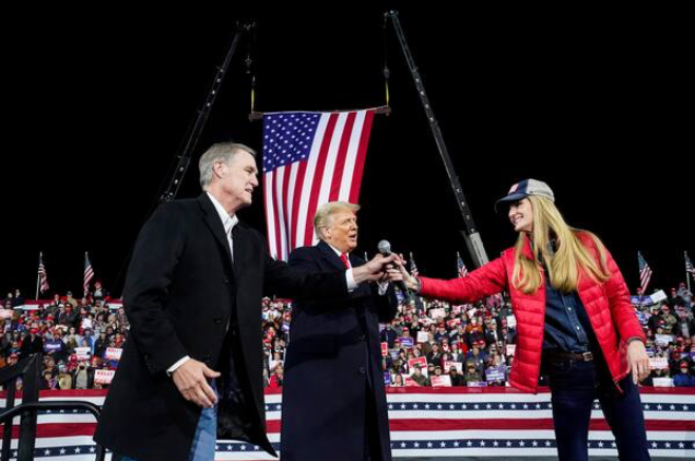 Senators David Perdue and Kelly Loeffler share the stage with President Trump during a rally Saturday night in Valdosta, Ga. MUST CREDIT: Washington Post photo by Jabin Botsford