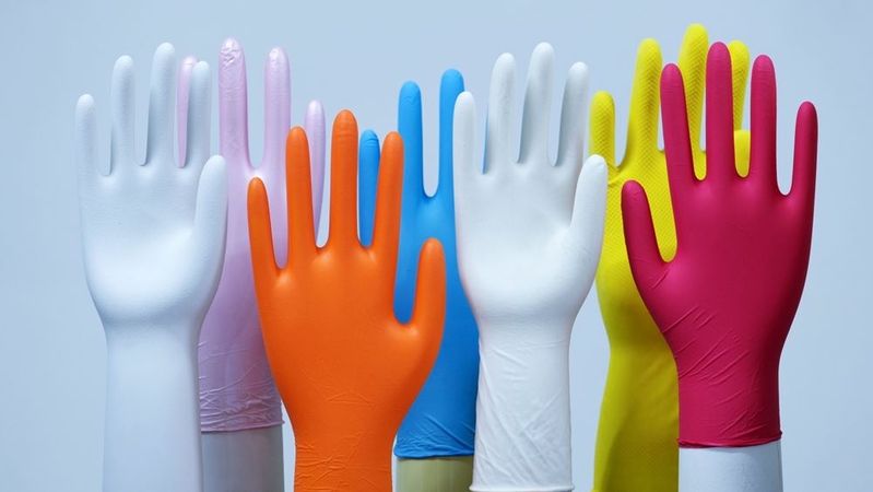 Latex gloves are displayed on hand-shaped molds at the Top Glove Corp. headquarters in Setia Alam, Malaysia, on Feb. 18, 2020. MUST CREDIT: Bloomberg photo by Samsul Said.