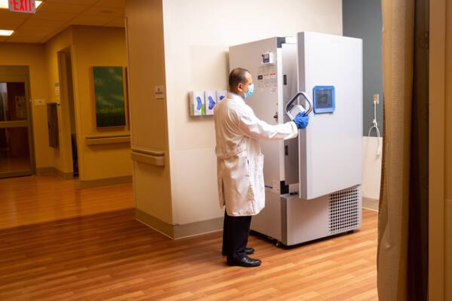 Pharmacy Director Ahmed El Kority opens a new ultra freezer that will be used to store COVID-19 vaccines at the Riverside Shore Memorial Hospital in Onancock, Va. MUST CREDIT: photo for The Washington Post by Parker Michels-Boyce.
