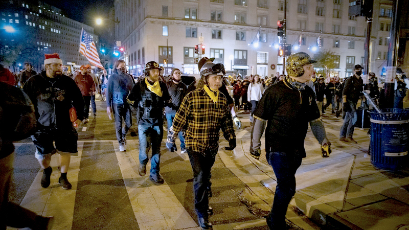 Proud Boys march in Washington, D.C., Saturday night. MUST CREDIT: Photo for The Washington Post by Evelyn Hockstein/For The Washington Post)