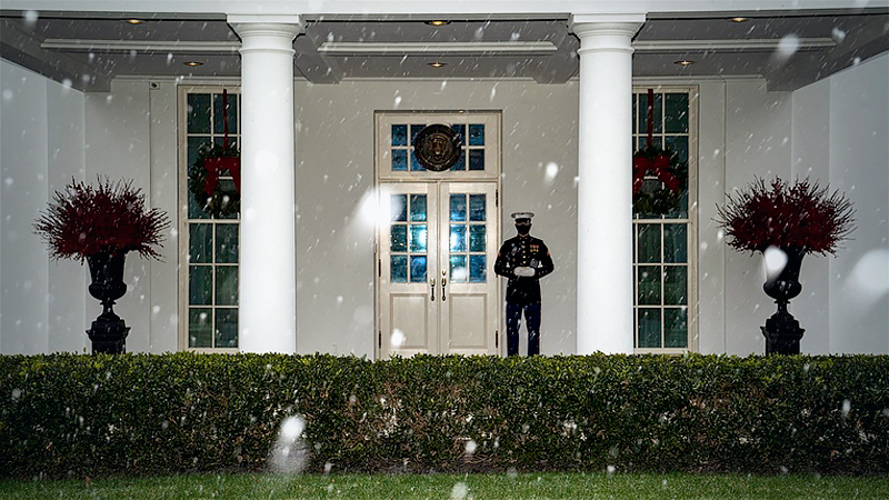 A Marine stands guard outside the West Wing as snow begins to fall at the White House on Wednesday, Dec 16, 2020 in Washington, D.C. MUST CREDIT: Washington Post photo by Jabin Botsford