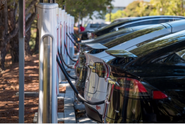 Tesla vehicles charge at a charging station in San Mateo, Calif., on Sept. 22, 2020. MUST CREDIT: Bloomberg photo by David Paul Morris.