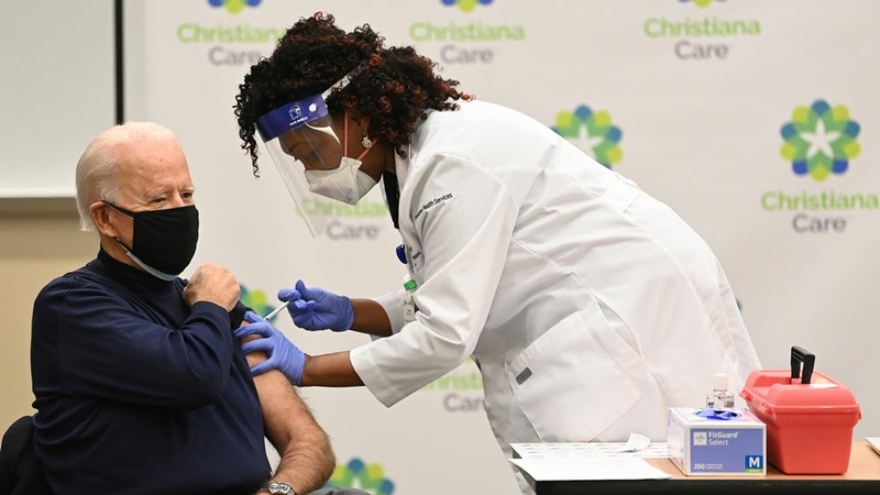 Tabe Mase gives President-elect Joe Biden his first dose of the coronavirus vaccine on Monday, Dec. 21, 2020. MUST CREDIT: Washington Post photo by Jonathan Newton