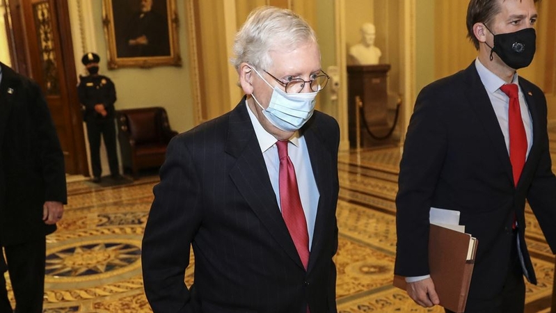 Senate Majority Leader Mitch McConnell, R-Ky., wears a protective mask while walking to his office at the U.S. Capitol in Washington, D.C., on Dec. 21, 2020. MUST CREDIT: Bloomberg photo by Oliver Contreras.
