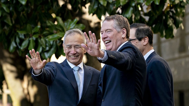 Robert Lighthizer and Liu He, China's vice premier, wave before a meeting at the Office of the U.S. Trade Representative in Washington, on Oct. 11, 2019. MUST CREDIT: Bloomberg photo by Andrew Harrer.