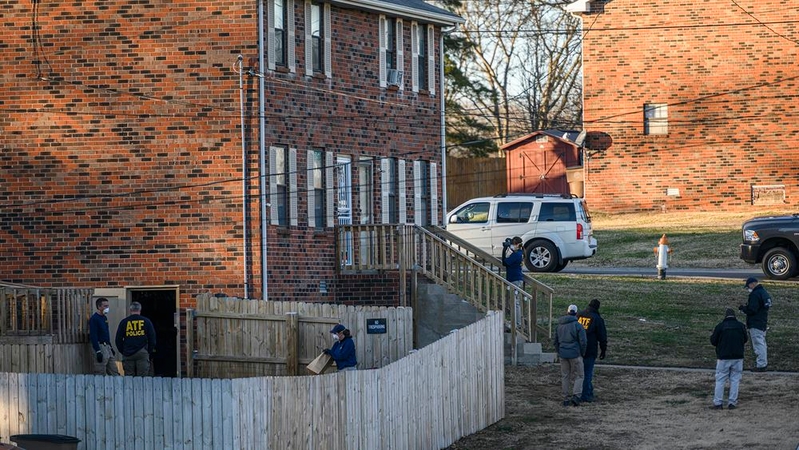 Investigators with the FBI, ATF and Metro Nashville Police Department investigate a home in Antioch, Tenn., on Saturday. MUST CREDIT: Photo for The Washington Post by William DeShazer