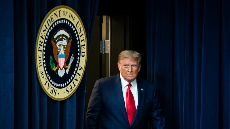President Donald Trump arrives in an auditorium at the White House complex before signing an executive order on vaccines earlier this month. MUST CREDIT: Washington Post photo by Jabin Botsford.