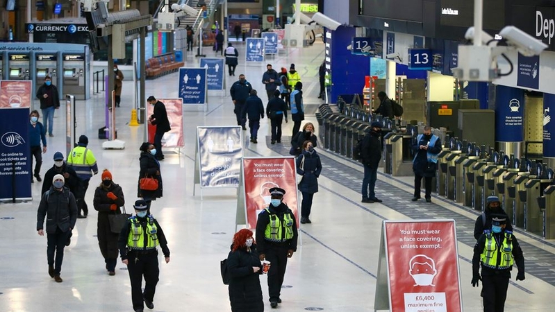 Police officers patrol the concourse at London Waterloo railway station on Jan. 5, 2021, as Britain goes back into lockdown in an attempt to prevent hospitals being overwhelmed. MUST CREDIT: Bloomberg photo by Hollie Adams