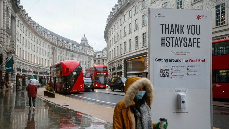 A pedestrian walks along Regent Street in London on Jan. 5. MUST CREDIT: Bloomberg photo by Hollie Adams.