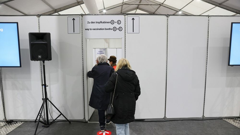Visitors enter to receive doses of the Pfizer-BioNTech covid-19 vaccine at a vaccination site in Wurzburg, Germany, on Jan. 4, 2021. MUST CREDIT: Bloomberg photo by Alex Kraus.