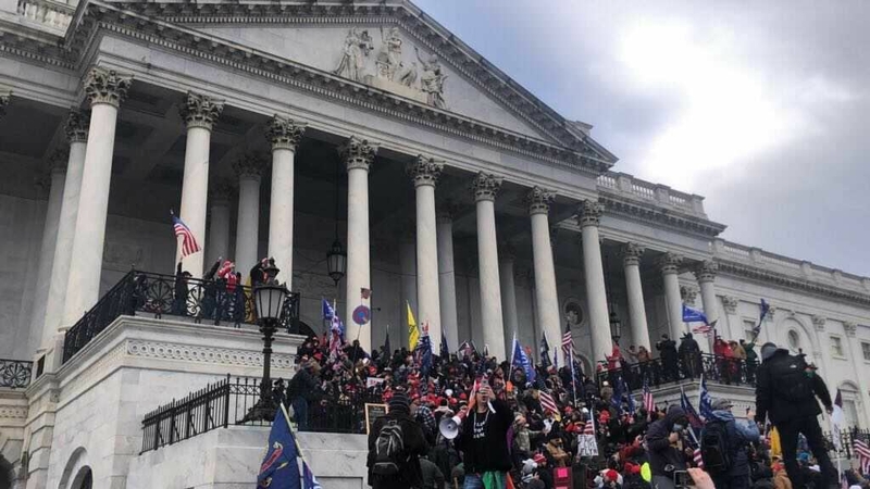 Supporters of President Trump stand outside the east side of the Capitol. MUST CREDIT: Washington Post photo by Marissa J. Lang