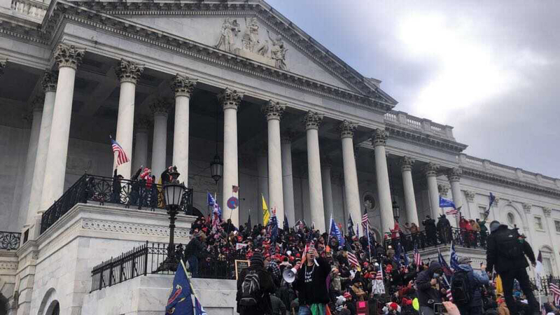 Supporters of President Trump stand outside the east side of the Capitol. MUST CREDIT: Washington Post photo by Marissa J. Lang