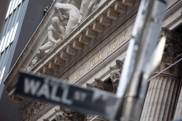 A Wall Street street sign in front of the New York Stock Exchange in New York on Jan. 4, 2021. MUST CREDIT: Bloomberg photo by Michael Nagle.
