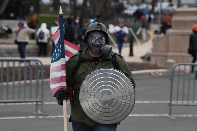 A Trump supporter outside the U.S. Capitol on Wednesday after others swarmed and invaded the building in a protest supporting the president's claim that the Nov. 3 election was rigged against him. 
Washington Post photo by Matt McClain