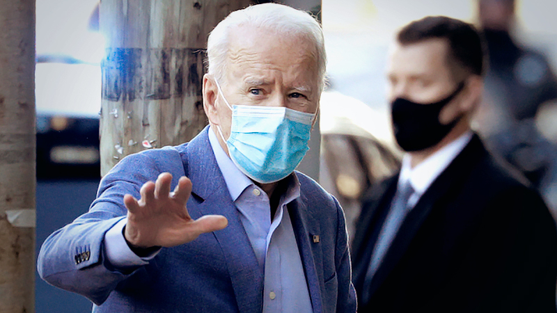 President-elect Joe Biden walks into the Queen theater in Wilmington, Del,, on Jan. 10. (Tom Brenner/ Reuters)