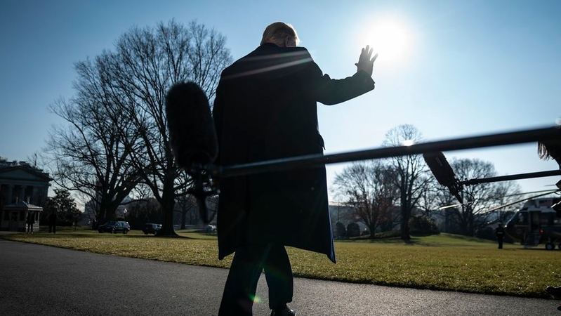 President Trump stops to talk to reporters as he walks to board Marine One and depart from the South Lawn on Tuesday. MUST CREDIT: Washington Post photo by Jabin Botsford