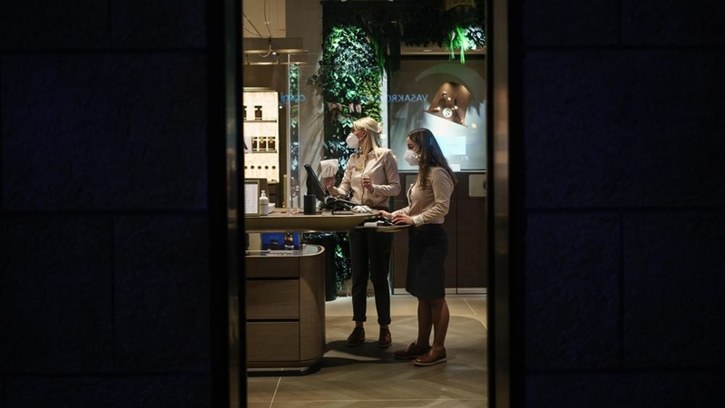 Employees wear protective face masks inside a store in Gothenburg, Sweden, on Dec 19, 2020. MUST CREDIT: Bloomberg photo by Fredrik Lerneryd.