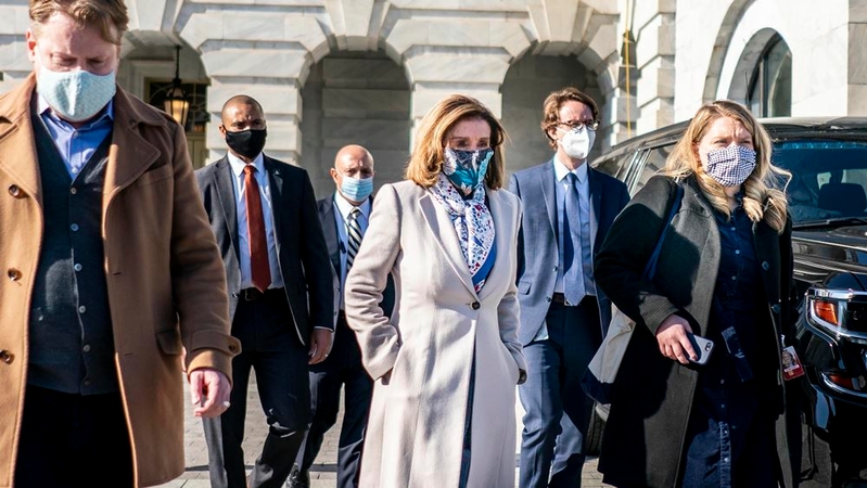 A week after the insurrection of the U.S. Capitol, Speaker of the House Nancy Pelosi greets the National Guard troops occupying and surrounding the newly fenced-in Capitol Complex in Washington, D.C., on Wednesday. MUST CREDIT: Washington Post photo by Melina Mara