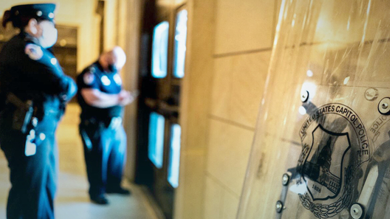 Capitol Police secure the rotunda doors as the U.S. Capitol becomes locked down because of a fire nearby. Police cleared the scene a short time later, and
no injuries were reported. (Melina Mara/ The Washington Post)