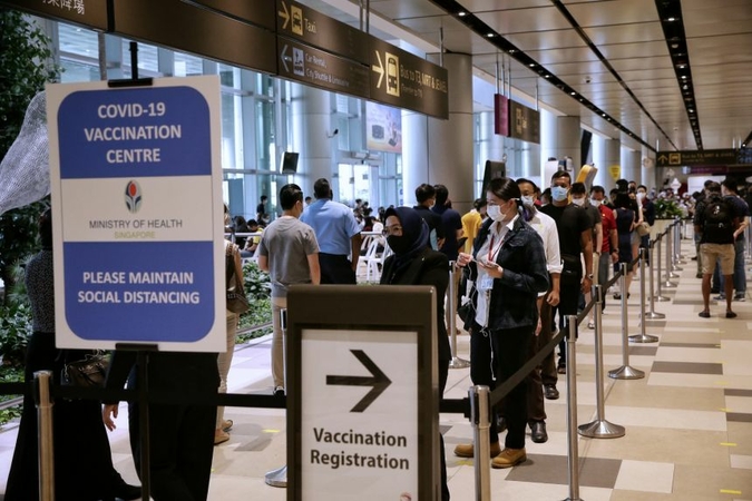 Front-line workers in the aviation industry registering for Covid-19 vaccination at Changi Airport Terminal 4, on Jan 18, 2021. ST PHOTO: KEVIN LIM