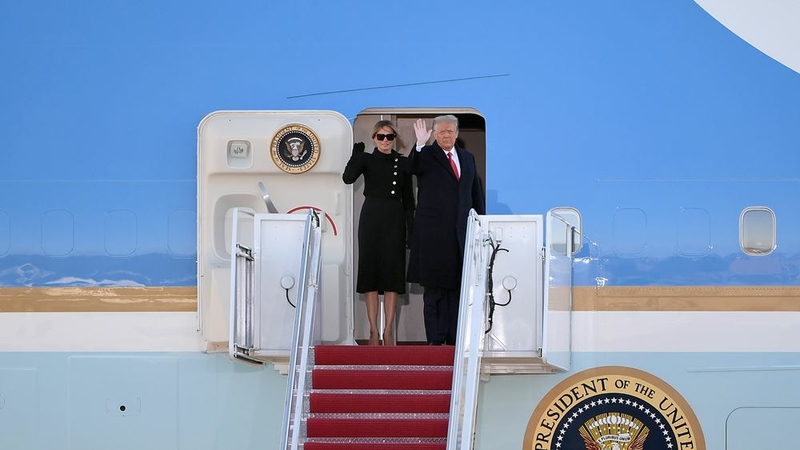 President Donald Trump and First Lady Melania Trump wave as they board Air Force One at Joint Base Andrews in Suitland, Md., on January 20, 2021. MUST CREDIT: Photo for The Washington Post by Will Newton