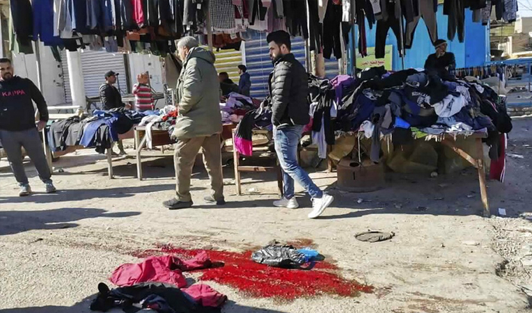 Rare twin suicide bombings rock Baghdad market, killing dozens Rare twin suicide bombings rock Baghdad market, killing dozens
