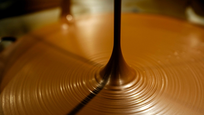 Chocolate pours into a bowl while being processed at the Auro Chocolate production facility in Calamba, Laguna province, Philippines, on Feb. 11, 2019. MUST CREDIT: Bloomberg photo by Hannah Reyes Morales.