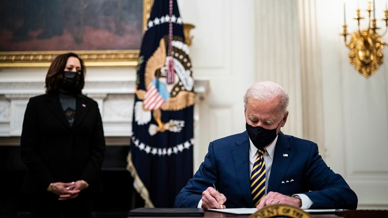 President Joe Biden signs executive orders at the White House on Friday, Jan 22, 2021. MUST CREDIT: Washington Post photo by Jabin Botsford