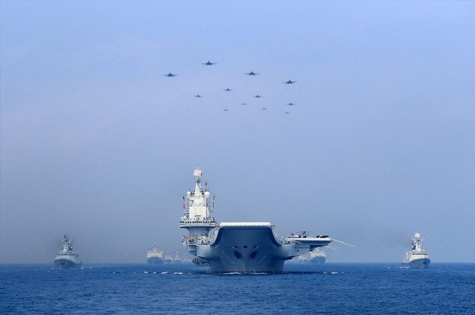 Warships and fighter jets of the Chinese People’s Liberation Army (PLA) Navy take part in a military display in the South China Sea April 12, 2018. REUTERS/Stringer