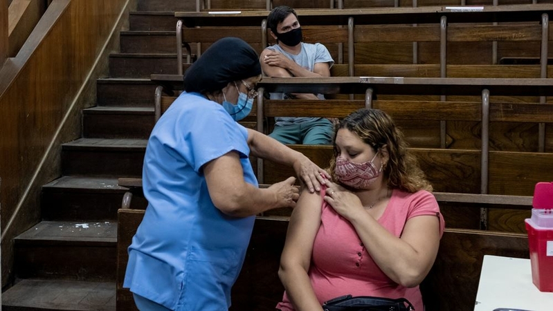 A healthcare worker receives a dose of the Russian Sputnik V Covid-19 vaccine at a hospital in La Plata, Argentina, on Jan. 11, 2021. MUST CREDIT: Bloomberg photo by Anita Pouchard Serra.