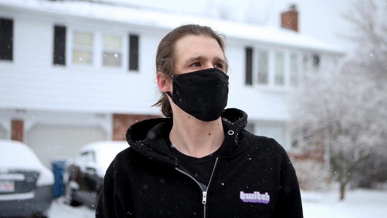 Jonathan Burlingame stands outside his home in Canton, Mass. MUST CREDIT: Photo for The Washington Post by Olivia Falcigno