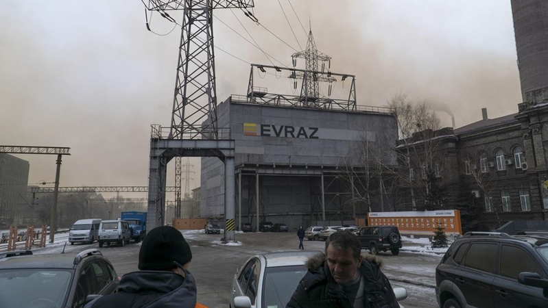 Workers arrive for their shifts at the main office at the Dneprovsky Iron & Steel Works, operated by Evraz Group, in Dnipro, Ukraine, on Jan. 25, 2017. MUST CREDIT: Bloomberg photo by Vincent Mundy