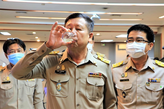 Sakda Vicheansil, director-general of the Department of Groundwater Resources, enjoys a glass of filtered natural carbonated water from Kanchanaburi’s natural ‘soda fountain’.