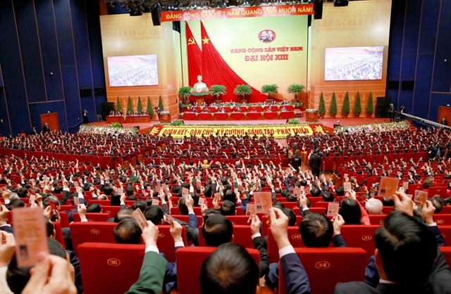 Party delegates voted to adopt the Resolution of the 13th National Party Congress at the final session of the Congress held on February 1, 2021. — VNA/VNS Photo 