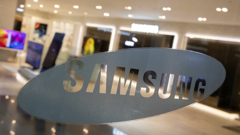 The Samsung Electronics logo is displayed in a window at the company's D'light flagship store in Seoul, South Korea, on Oct. 6, 2020. MUST CREDIT: Bloomberg photo by SeongJoon Cho.