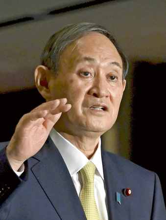 Prime Minister Yoshihide Suga speaks to reporters in Tokyo on Wednesday. (The Yomiuri Shimbun)