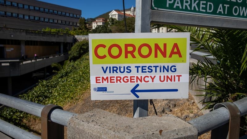 A coronavirus testing unit sign is displayed outside Groote Schuur hospital in Cape Town, South Africa, on Jan. 11, 2021. MUST CREDIT: Bloomberg photo by Dwayne Senior.