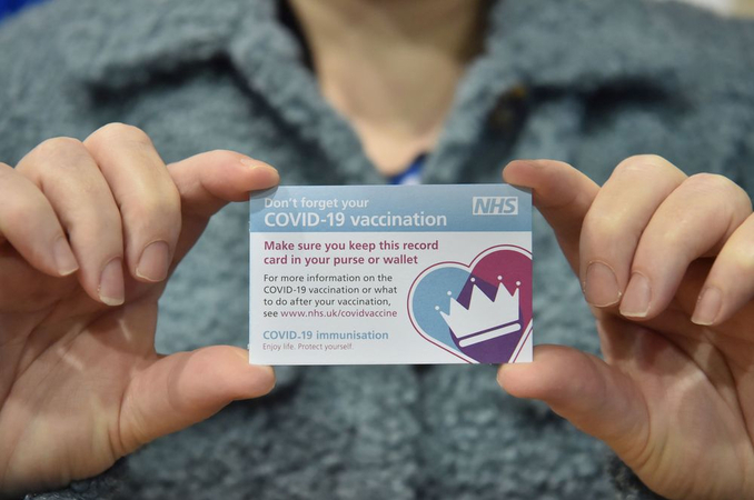 A Covid-19 Vaccination Record Card at a vaccination centre in Cardiff, U.K. Photographer: Ben Birchall/PA Wire/Bloomberg